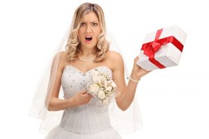 0_Displeased-bride-holding-a-wedding-present - TA NEA - TA NEA