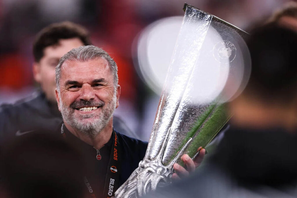 Postecoglou holds The 2025 UEFA Europa League finals trophy.jpg