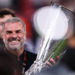 Postecoglou holds The 2025 UEFA Europa League finals trophy.jpg