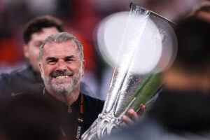 Postecoglou holds The 2025 UEFA Europa League finals trophy.jpg